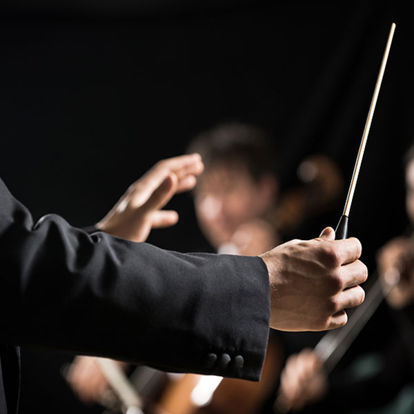 conductor leading the orchestra