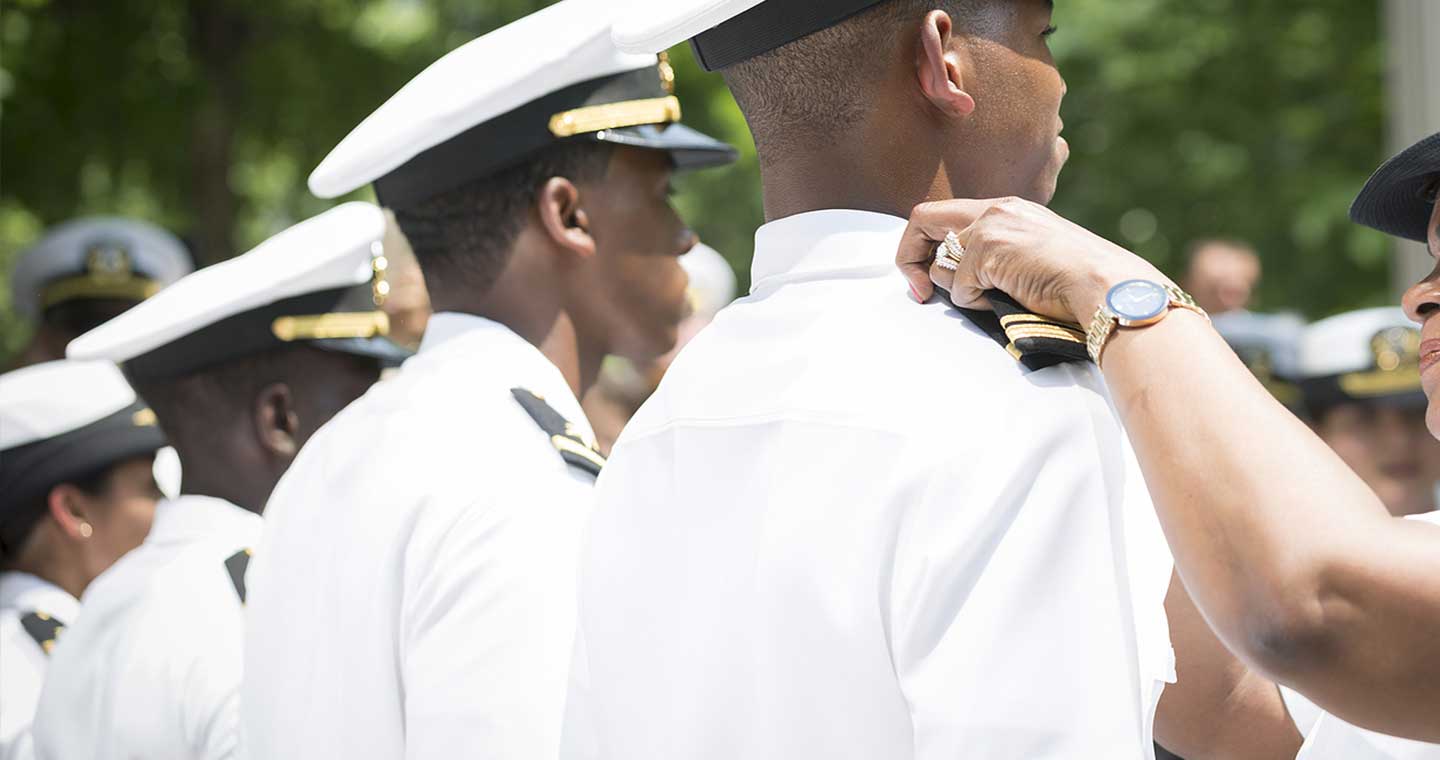 US Navy sailor receives his promotion insignia