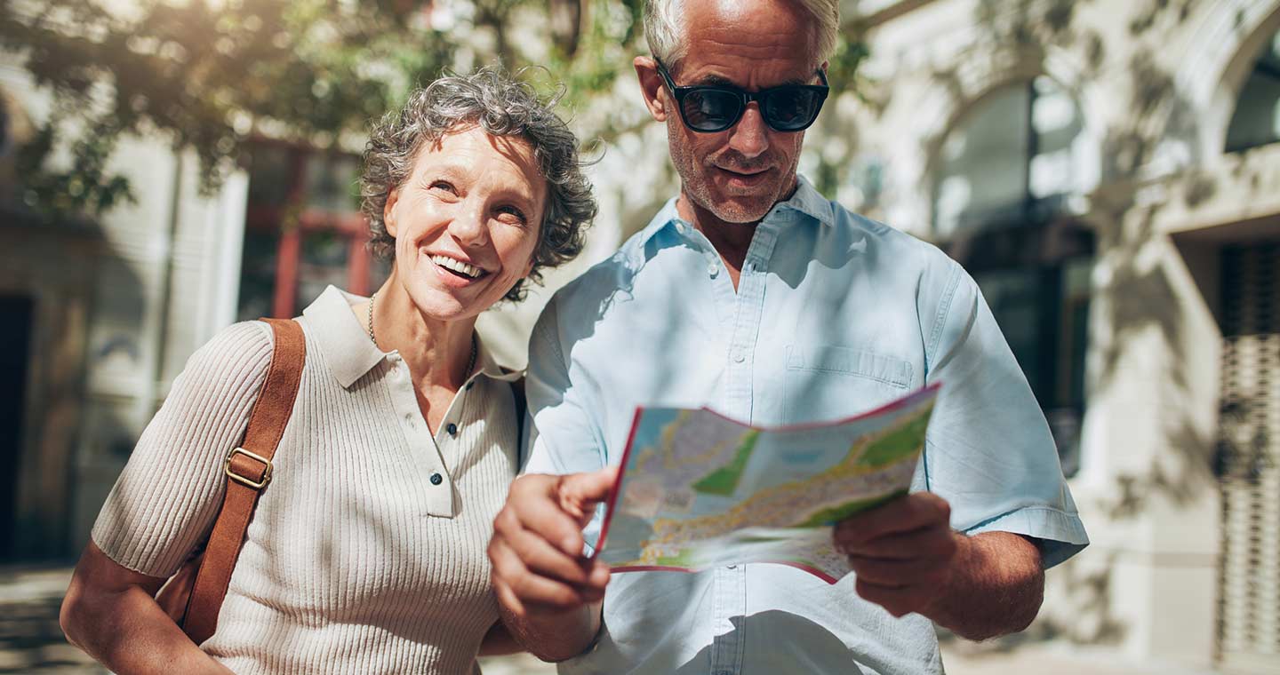 Mature man and woman using map while sightseeing in Annapolis